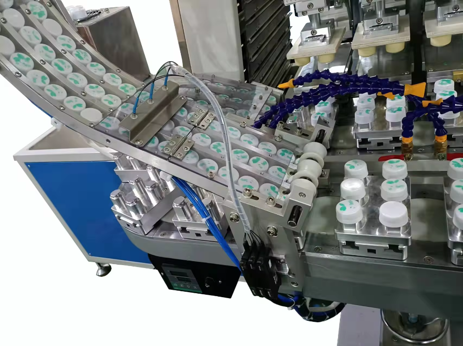 automatic bottle <a href=https://www.printersuppliercn.com/Automatic-Bottle-Cap-Pad-Printer-p.html target='_blank'>cap printing machine</a>